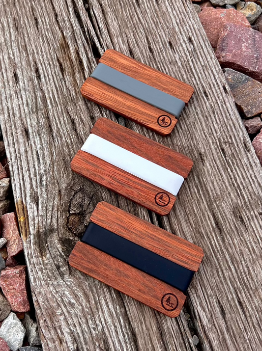 Wood front pocket Nomad wallet offered in three colors, black, whites and gray.