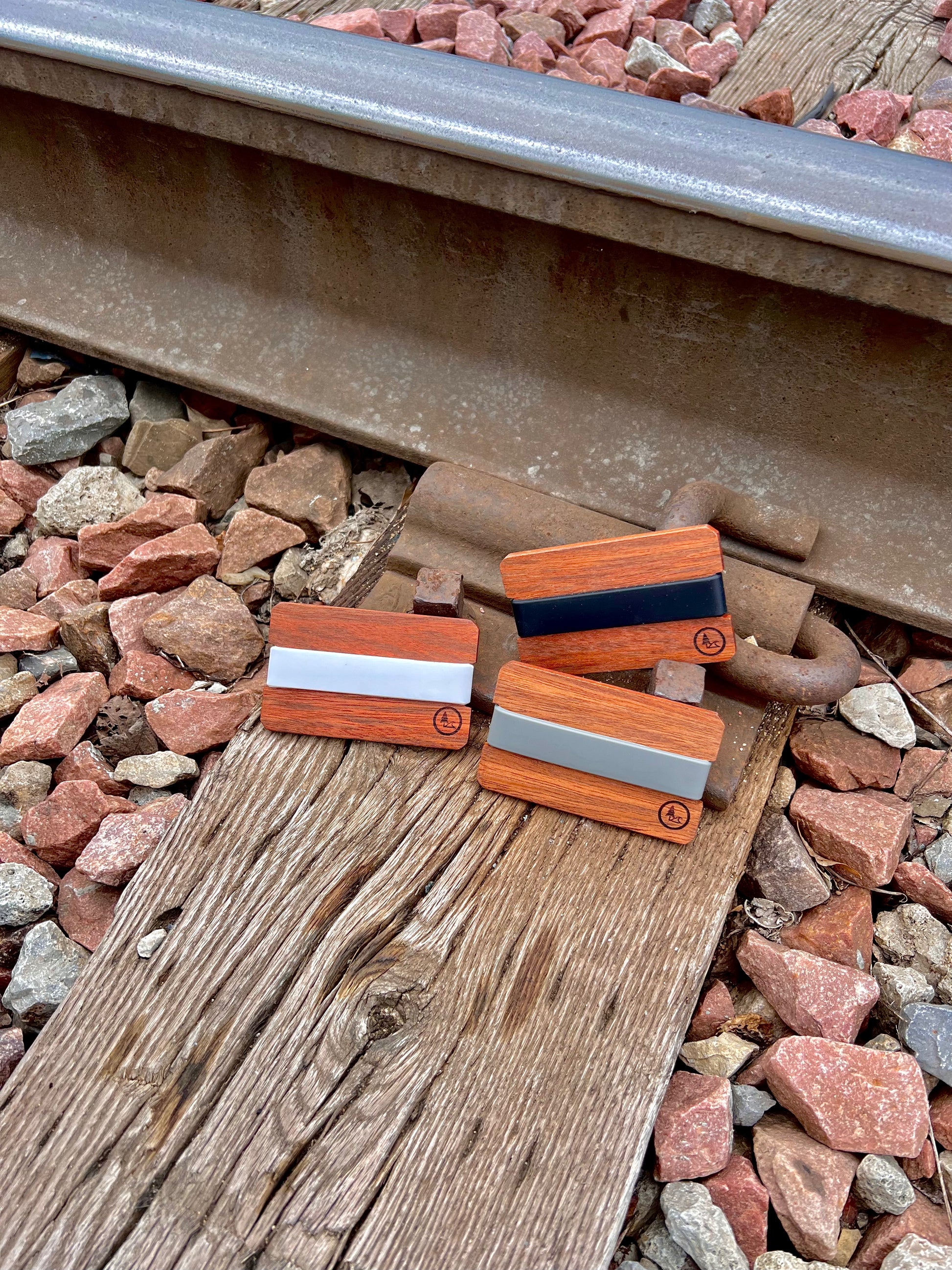 Nomad wood front pocket wallet offered in three different colors, black, white, and gray. 